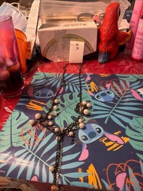 Lia Sophia Melodrama necklace features faux pearls, resin beads, and a hematite